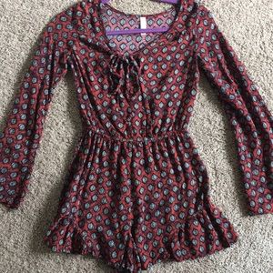 Red and maroon long sleeved patterned romper